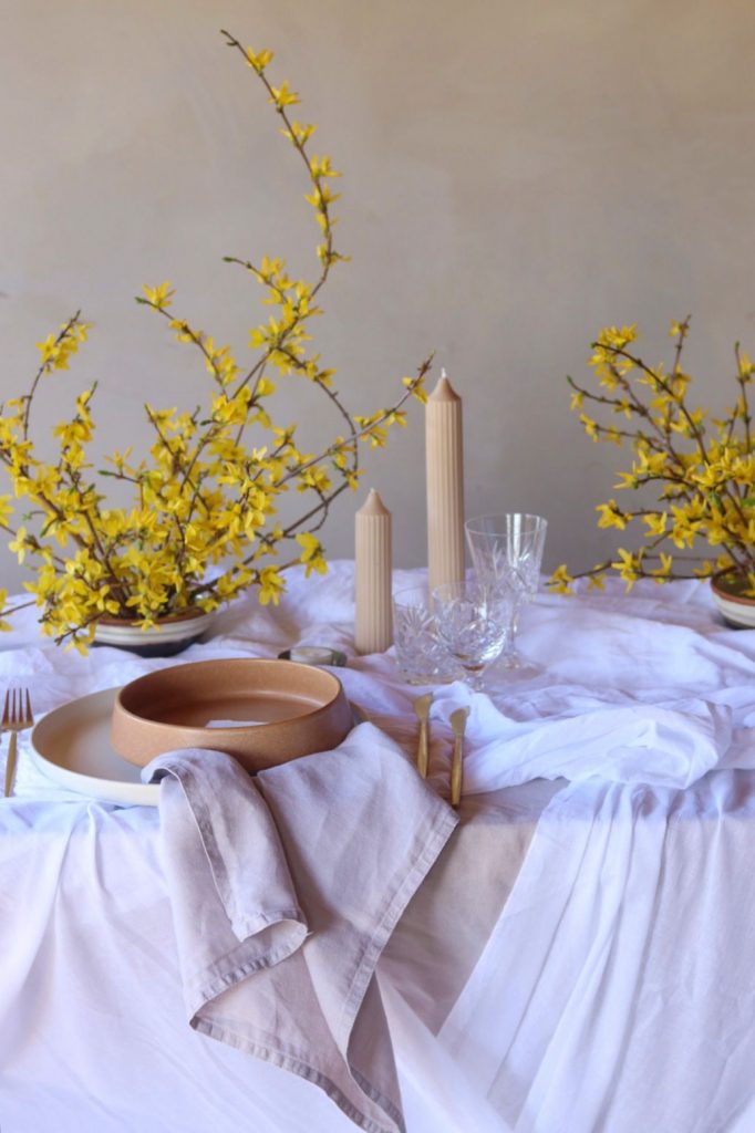 linen napkins provide a subtle colour contrast.. Full  spring tablescape view